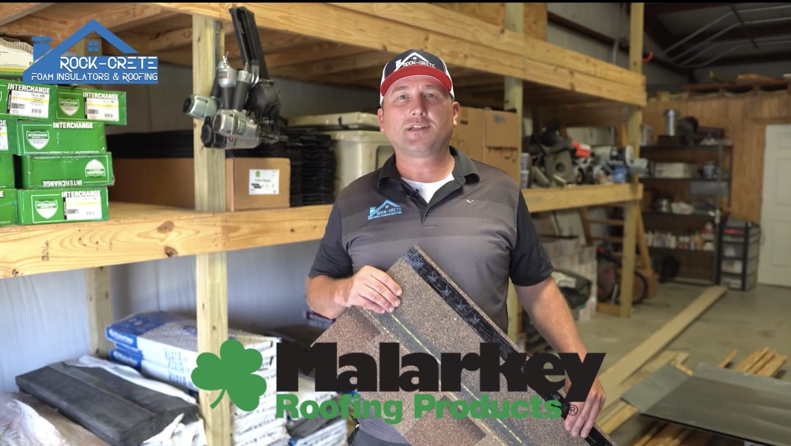 Aaron holding a Malarkey Shingle